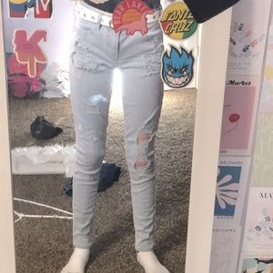 Size 4 Grey American Eagle Outfitters Jeans with rips